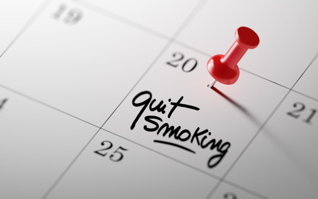 Calendar with reminder to quit smoking on the 20th of the month, red thumbtack holding calendar in place. Banner image that introduces five steps to quit smoking